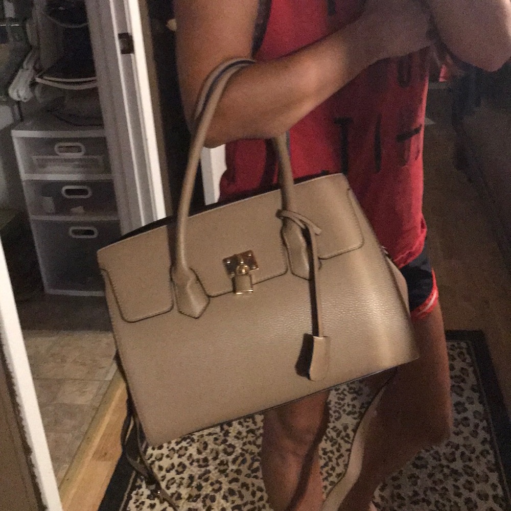 Tan purse with a lock